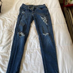 Dark blue jeans ripped